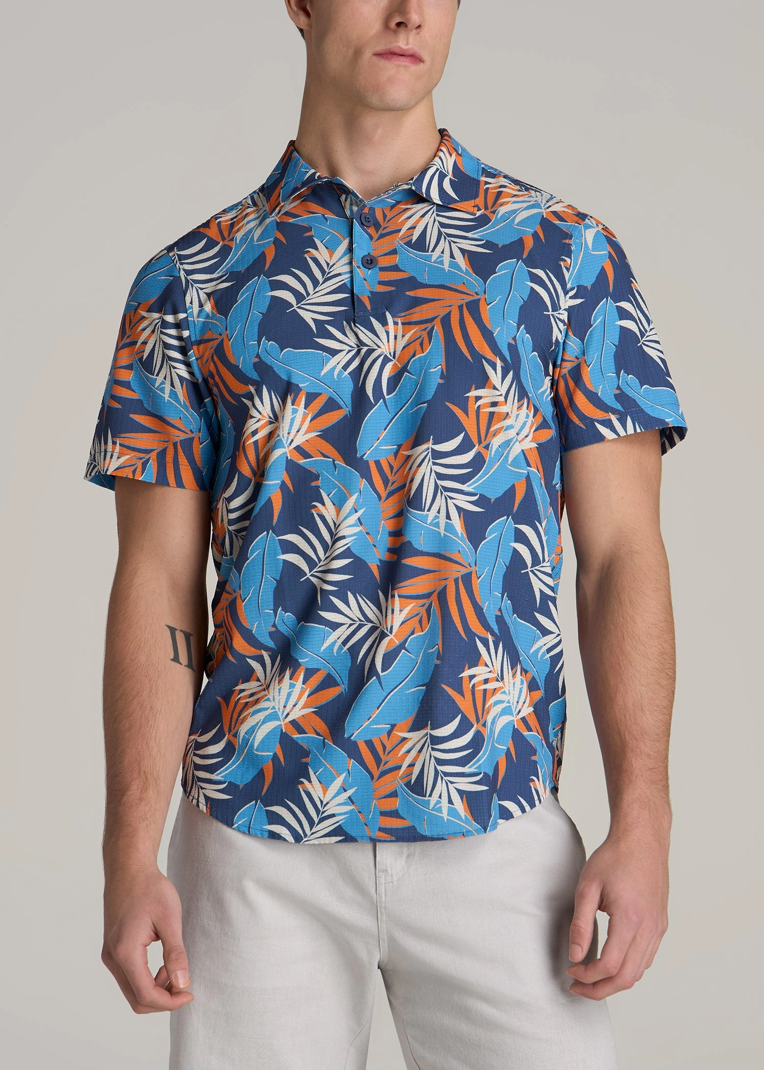 Coastal Perforated Tall Men's Polo Shirt in Blue and Orange Palms EcoFriendlyMaterial Reinforced Neckline Detail