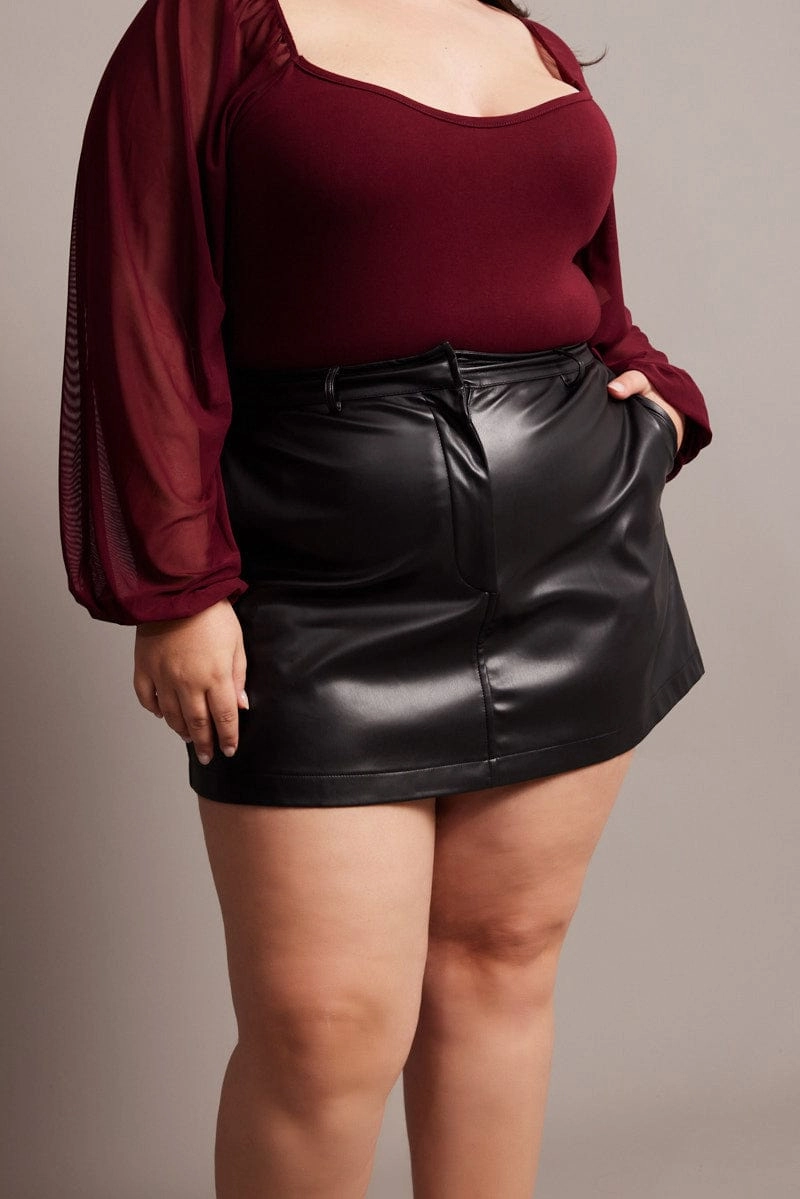 Crisscross Back Urban Edge Black Faux Leather A-line Mini Skirt